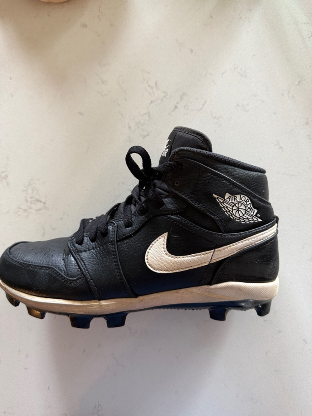 Jordan baseball cleats Kids Black and White High-Top Sneakers with Swoosh